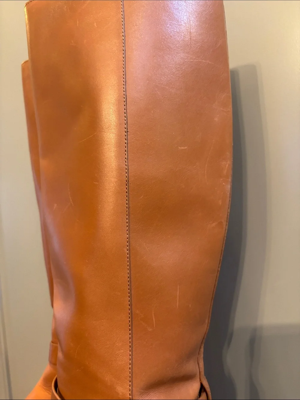 Tory Burch Brooke knee-high boots in tan leather. 11